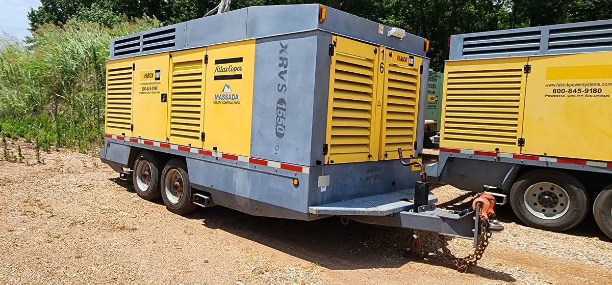 Atlas Copco XRVS 1550 CD portable air compressor - exterior side view on trailer