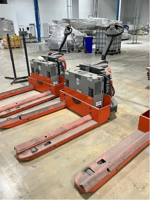 Warehouse pallet jacks - lot of manual pallet jacks in warehouse