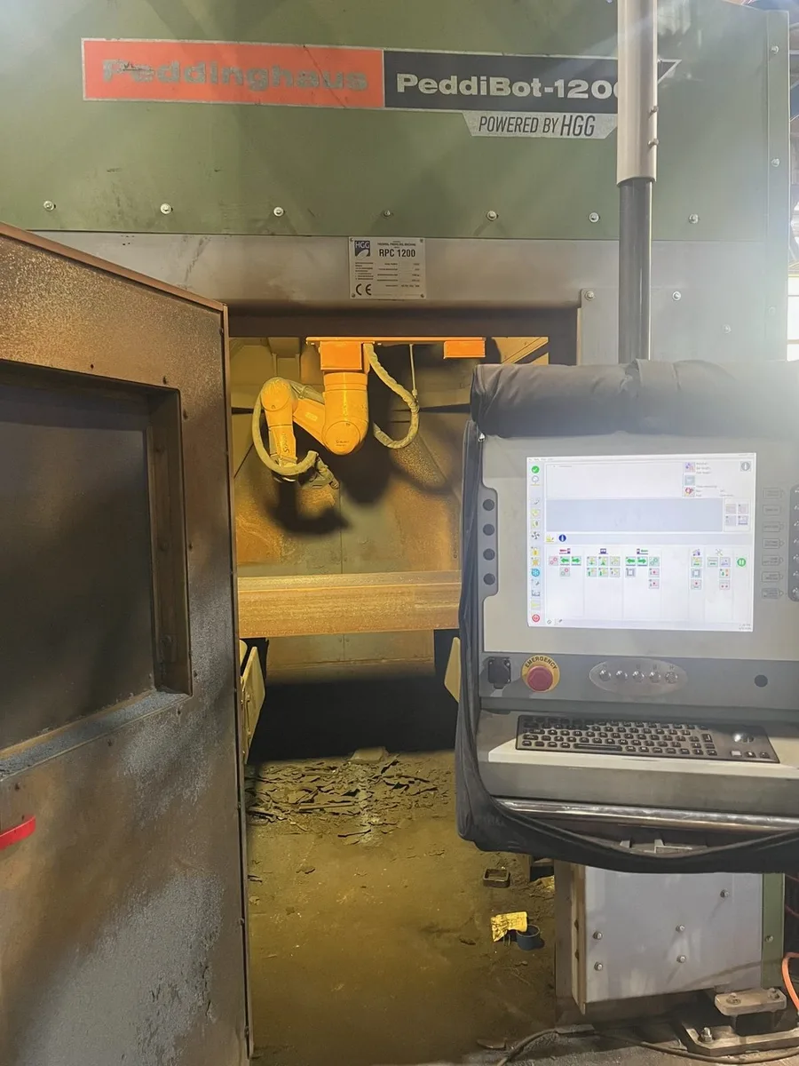 Click to enlarge Peddinghaus PeddiBot-1200 control station with HMI touchscreen and RPC 1200 cutting enclosure