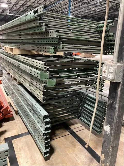 Industrial warehouse racking - multiple bays of steel shelving