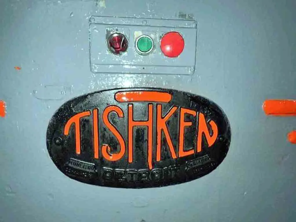 Tishken rollformer - Tishken oval nameplate and control buttons close-up